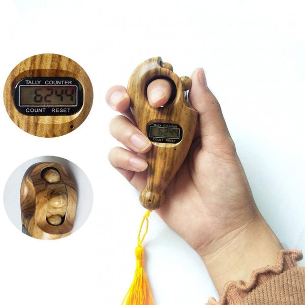 Person holding digital Tasbih counter for Dhikr
