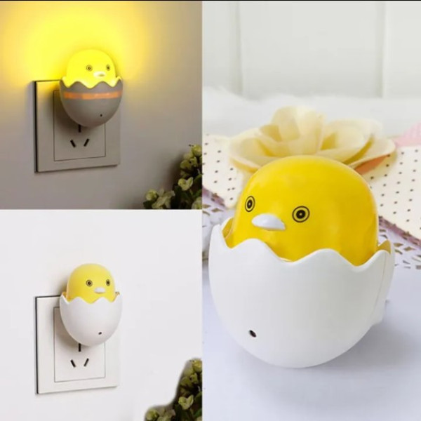 Small yellow duck shaped LED night light with smart sensor, soft warm glow for kids bedroom and home decoration